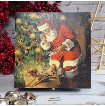 Caja Papa Noel junto al árbol